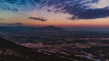 landscape of a sunset in the mountains from a drone with incredible colorsの写真素材