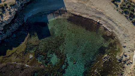 aerial view of a beach with turquoise water, Cala Mijo, Aguilas, Murcia, Spainの写真素材
