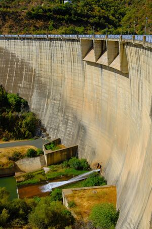 Vertical view of the dry side of a damの写真素材