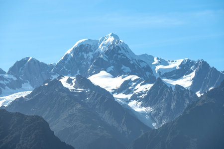 The view of Mt. Tasman peak, one of the famous landmark, near Mt. Cook in a fresh sunny day under blue sky, West Coast, New Zealand.の写真素材