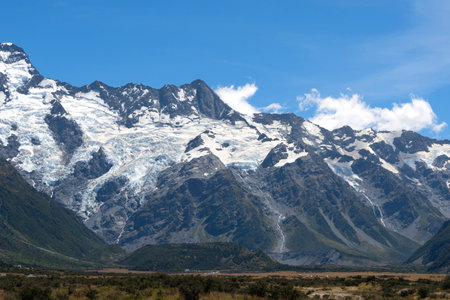 The massive mountains with glacier in a peaceful summer day with fresh blue sky at Mount Cook National Park, New Zealand.の写真素材