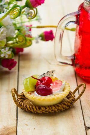 Fruits tarts on wooden tableの写真素材