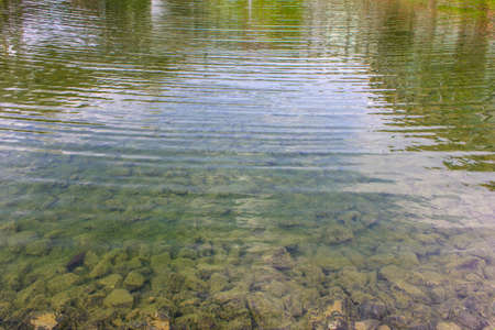 waves in water pond apply design textures and background.の写真素材