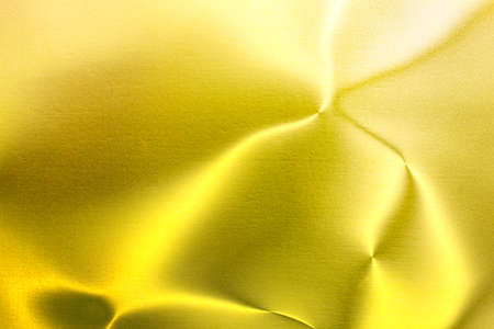 Shiny yellow leaf gold foil texture background.の写真素材