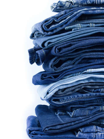 jeans stacked on white background blank for design and text input.の写真素材