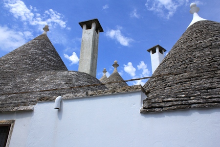 Trulli houses with conical roofs in Alberobello, Italy, Pugliaの写真素材