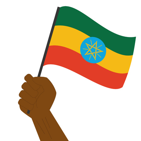 Hand holding and raising the national flag of Ethiopiaのイラスト素材
