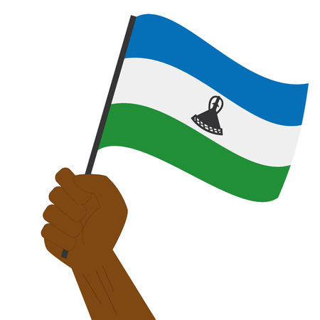 Hand holding and raising the national flag of Lesothoのイラスト素材