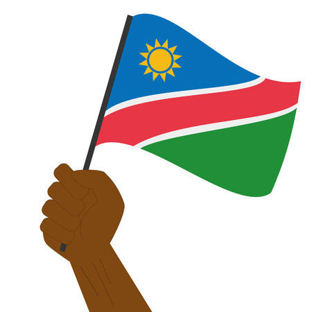 Hand holding and raising the national flag of Namibiaのイラスト素材