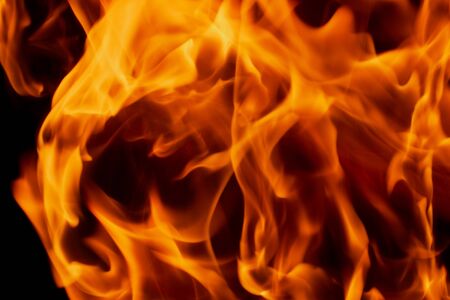 Fire flames on Abstract art black background, Burning red hot sparks rise, Fiery orange glowing...