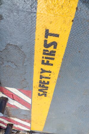 Safety First sign on caution strip.の写真素材