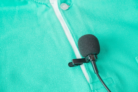 Close-up of  holding a Wireless lavalier microphoneの写真素材