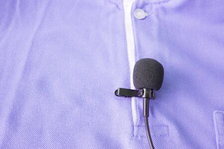 Close-up of  holding a Wireless lavalier microphoneの写真素材