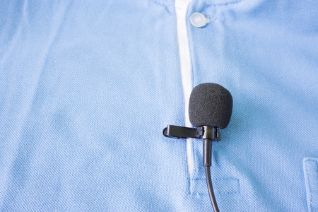Close-up of  holding a Wireless lavalier microphoneの写真素材