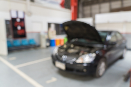 Blurred of car technician repairing the car in garage background.の写真素材