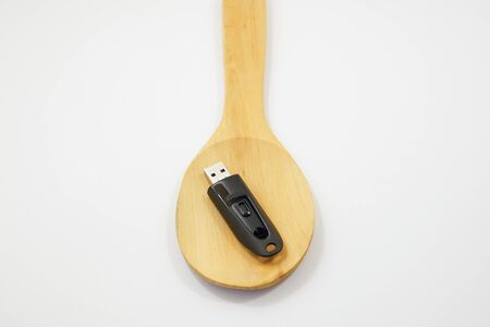 Eat data - usb flash drive on the spoon and fork.の写真素材