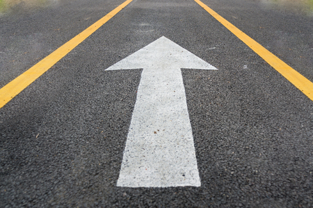 arrow in road,Bicycle road sign on asphalt. Leisure activitiesb,Bicycle road sign and bike rider.の写真素材