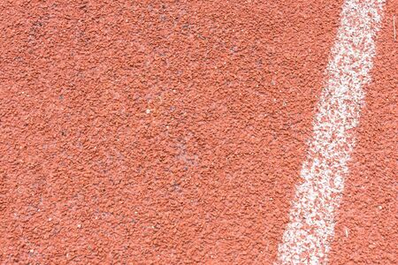Red running tracks in sport stadium background.の写真素材