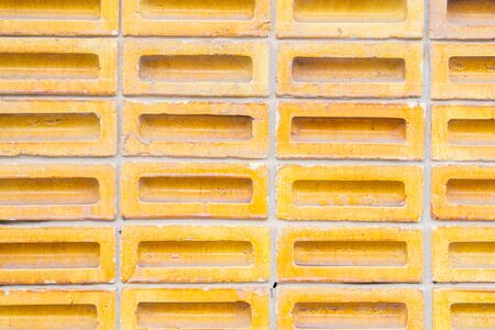 Background of yellow color old vintage brick wall