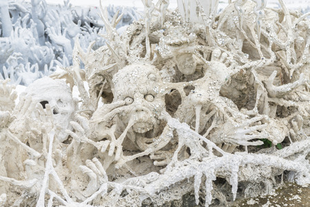Statue of mythological head in Wat Rong Khun. Wat Rong Khun is a contemporary unconventional Buddhist temple in Chiang Rai, Chiangmai province, Thailand.の写真素材