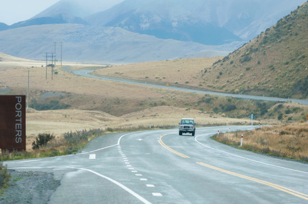 QUEENSTOWN, NEW ZEALAND - November 1: Tourists driving in New Zealand country road on a rainy dayon November 1, 2014 in Queenstown, New Zealand.のeditorial素材