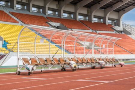 Abstract Blur Background : Grandstand and Red running race tracks in sport stadium