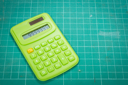 Calculator on the cutting matの写真素材