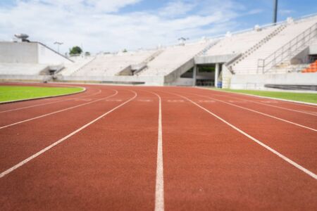 Abstract Blur Background :  Red running tracks in sport stadiumの写真素材