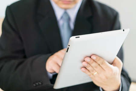 Asian Business man use tablet pcの写真素材