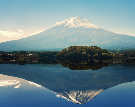 Mount Fuji from Kawaguchiko in march.Snow-capped Mount Fuji with clear sky background,Reflection Mount fuji at Lake kawaguchiko,selective focus,vintage color.の写真素材