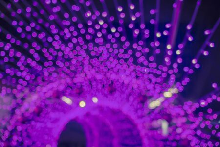 Abstract circular bokeh background of Christmas light,Blue Festive Christmas elegant abstract background with bokeh lights and starsの写真素材
