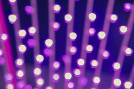 Abstract circular bokeh background of Christmas light,Blue Festive Christmas elegant abstract background with bokeh lights and starsの写真素材