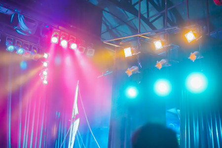 blurred background of night bokeh light,abstract texture background concert light background illumination,Blurred stage lights a rock concert,Stage spotlights,vintage colorの写真素材