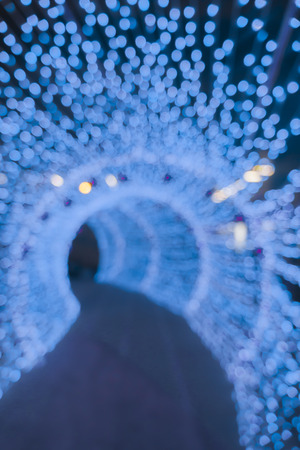 Abstract circular bokeh background of Christmas light,Blue Festive Christmas elegant abstract background with bokeh lights and starsの写真素材