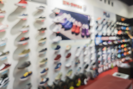 Blur of city shopping people crowd at marketplace shoe shop abstract background.の写真素材
