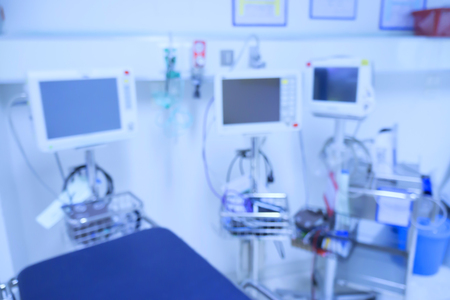 Blur of equipment and medical devices in modern operating room take with art lighting and blue filter,ready for operation,interior of the operating room with the anesthesiology machineの写真素材