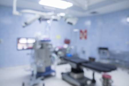 Blur of operating room,equipment and medical devices in modern operating room take with art lighting and blue filter,operating room with modern equipment.Operating room ready for operationの写真素材