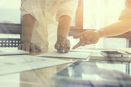 business plan,Cooperation Corporate Achievement Planning ,Business people discussing the charts and graphs showing the results of their successful teamwork,vintage color,selective focusの写真素材