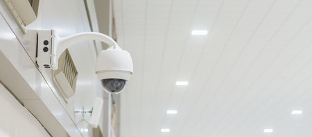 security camera or cctv camera,CCTV or Closed-circuit television Camera Operating inside a airport or train station or department store,selective focus,copy spaceの写真素材