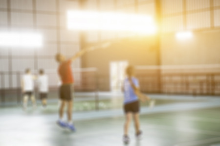 Blurred background of the shuttlecock and badminton courts with players competing in modern gym,vintage colorの写真素材