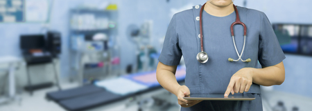 Medical and healthcare,Male doctor or medical students or surgeon,anesthesiologists using digital tablet during the conference,Health Check with digital system support for patient,background bannerの写真素材