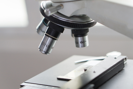 medical laboratory, scientist hands using microscope for chemistry test samples,examining samples and liquid,Medical equipment. microscope,Scientific and healthcare research background.vintage colorの写真素材