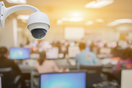 Closed-circuit television,CCTV Camera Operating inside Class room,computer room,use video cameras transmit a signal to a specific place,on white background with clipping path.の写真素材