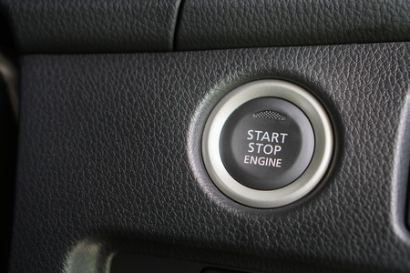 Start stop engine modern new car button ,selective focus