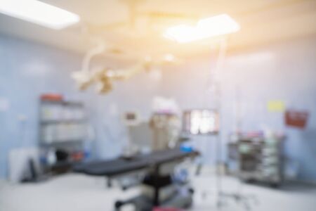 Blur of equipment and medical devices in modern operating room take with art lighting and blue filter,ready for operation,interior of the operating room with the anesthesiology machine,or roomの写真素材