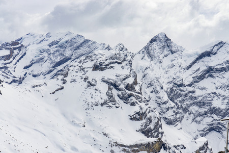 Landscape of Jungfrau Mountain Range in Switzerland, View of the Eiger, Monch and Jungfrau peaks from the Schilthorn (Piz Gloria), Lauterbrunnen, Bernese Alps, Switzerland, Europe, selective focusの写真素材