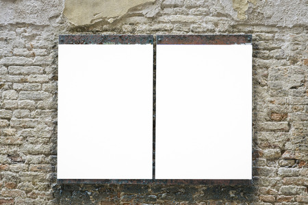 Blank advertising billboard on a street old wall.Blank billboard on brick wall.Billboard in the street.,blank billboard - advertising public commercial,ready for new advertisement,selective focusの写真素材