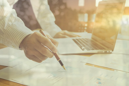 Young Business People Gathered Together Discussing Creative Idea Cafe.Startup Concept Coworkers Meeting.Brainstorming Work Process Office.Using Modern Electronics Gadgetsの写真素材