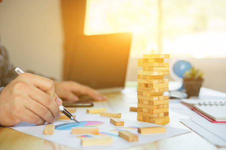 Planning, risk and strategy of project management in business, Male manager putting his ideas and writing business plan at workplace,man holding pens and papers, making notes in documentsの写真素材