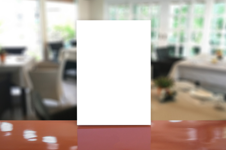 Mock up Menu frame on Table in Bar restaurant cafe,Stand for booklets with white sheets of paper acrylic table tent card mockup on wooden table on cafe teria ,can be used for montage or displayの写真素材